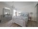 Bedroom with wood-look floors, light gray furnishings, and a decorative chandelier at 2921 W El Prado Blvd, Tampa, FL 33629