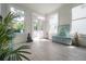 Bright entryway with white walls, tile flooring, and large windows offering plenty of natural light at 2921 W El Prado Blvd, Tampa, FL 33629