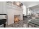 Modern fireplace featuring a white brick surround, decorative mantle, and tile flooring at 2921 W El Prado Blvd, Tampa, FL 33629