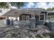 Charming single-story home featuring a covered front porch with classic white trim and gray accents at 2921 W El Prado Blvd, Tampa, FL 33629