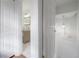 Hallway featuring a bathroom with a vanity and an overhead light fixture at 2921 W El Prado Blvd, Tampa, FL 33629