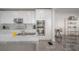 Bright and modern kitchen featuring marble countertops, stainless steel appliances, white cabinets, and an open layout at 2921 W El Prado Blvd, Tampa, FL 33629