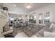 Open floor plan showcasing the living room with stylish furnishings and tile flooring at 2921 W El Prado Blvd, Tampa, FL 33629