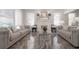 Spacious living room featuring tile flooring, a modern fireplace, and comfortable gray sofas at 2921 W El Prado Blvd, Tampa, FL 33629
