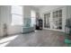 Bright living room featuring wood floors, a beverage cooler, and French doors at 2921 W El Prado Blvd, Tampa, FL 33629