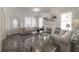 Bright living room with high ceilings, fireplace, modern decor and stylish gray sofas at 2921 W El Prado Blvd, Tampa, FL 33629