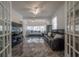 Cozy living room with ceiling fan, comfortable seating, and bright sunlight streaming in at 2921 W El Prado Blvd, Tampa, FL 33629