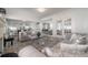 Spacious living room featuring tile flooring, comfortable seating, and an open floor plan at 2921 W El Prado Blvd, Tampa, FL 33629