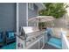 Outdoor kitchen and patio area with built-in grill and ample counter space at 2921 W El Prado Blvd, Tampa, FL 33629