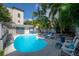 Inviting pool with chaise lounges and seating surrounded by lush landscaping at 2921 W El Prado Blvd, Tampa, FL 33629