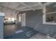 Inviting front porch featuring a porch swing, white pillars, and gray accents at 2921 W El Prado Blvd, Tampa, FL 33629