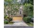 Charming townhouse featuring a classic brick facade and two-car garage at 3571 Edington Way, Palm Harbor, FL 34685