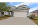 Two-car garage of a charming two-story home with well-manicured landscaping in a lovely neighborhood at 3609 W Iowa Ave, Tampa, FL 33611