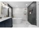 An elegant bathroom offers a soaking tub, a frameless shower, and designer fixtures at 404 W Violet St, Tampa, FL 33603