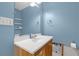 Bathroom offering a pedestal sink, mirror, and shelves, awaiting trim and flooring for a personalized space at 4390 Cherry Ne St, St Petersburg, FL 33703