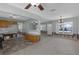 Living room flowing into kitchen with nice light fixtures and fans at 4390 Cherry Ne St, St Petersburg, FL 33703