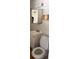 A bathroom showing white tiled walls, a toilet, and a vanity sink with mirror at 4501 27Th S Ave, Gulfport, FL 33711