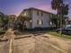 Charming two-story condo with well-kept landscaping, and assigned parking spaces at 4928 W Gandy Blvd # G203, Tampa, FL 33611