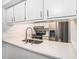 Modern kitchen featuring white countertops, stainless steel appliances, and a spring faucet at 4928 W Gandy Blvd # G203, Tampa, FL 33611