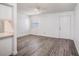 Bright living space with modern wood-look flooring and neutral wall colors at 4928 W Gandy Blvd # G203, Tampa, FL 33611