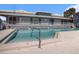 Clear view of condo pool showing depth markers; office is located in the community clubhouse at 4928 W Gandy Blvd # G203, Tampa, FL 33611