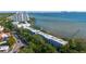 Aerial view of luxury waterfront townhomes with city skyline in the distance at 5010 Bayshore Blvd # 9, Tampa, FL 33611