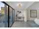 Bright bedroom with a desk, large window offering outdoor views, and modern decor at 5010 Bayshore Blvd # 9, Tampa, FL 33611