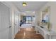 Inviting foyer featuring hardwood floors, a console table with decor, and a glimpse of the water view at 5010 Bayshore Blvd # 9, Tampa, FL 33611