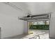 Spacious two car garage with freshly painted white walls and automatic door at 5010 Bayshore Blvd # 9, Tampa, FL 33611