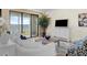 Cozy living room featuring a balcony view, plush seating, and a contemporary media console at 5010 Bayshore Blvd # 9, Tampa, FL 33611