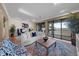 Well-lit living room offering water views, comfortable seating, and a chic, patterned armchair at 5010 Bayshore Blvd # 9, Tampa, FL 33611