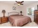 A bedroom features neutral tones, a window for natural light, and matching bedside tables at 5231 Beach Se Dr # A, St Petersburg, FL 33705