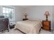 A cozy bedroom with a window provides natural light and ample space for relaxation at 5231 Beach Se Dr # A, St Petersburg, FL 33705