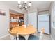 A dining area with a round table and chairs is adjacent to the kitchen, offering a cozy space at 5231 Beach Se Dr # A, St Petersburg, FL 33705