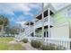 Charming two-story home with exterior staircase and inviting patio spaces at 5231 Beach Se Dr # A, St Petersburg, FL 33705