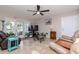 The living room features tile floors, a ceiling fan, and views of the outdoor patio at 5231 Beach Se Dr # A, St Petersburg, FL 33705