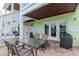Brick patio features outdoor dining set and direct access to the home at 5231 Beach Se Dr # A, St Petersburg, FL 33705