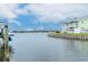 Scenic waterfront property showcasing a well-maintained seawall and lush greenery at 5231 Beach Se Dr # A, St Petersburg, FL 33705
