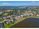 Breathtaking aerial view showcasing a lakeside neighborhood with stunning homes and picturesque lake views at 5325 Sandy Shell Dr, Apollo Beach, FL 33572