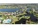 Expansive aerial view showcasing the community's lakeside homes, winding paths, and common areas at 5325 Sandy Shell Dr, Apollo Beach, FL 33572