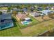 Aerial view of a fenced backyard with pool, spa, and screened patio at 5325 Sandy Shell Dr, Apollo Beach, FL 33572