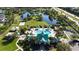 Aerial view of a resort-style community pool with seating, landscaping, and additional amenities at 5325 Sandy Shell Dr, Apollo Beach, FL 33572