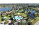 Aerial shot of community pool, basketball court, and green space surrounded by beautiful homes at 5325 Sandy Shell Dr, Apollo Beach, FL 33572