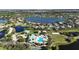 An aerial image displaying the community pool, surrounded by manicured landscaping and lake views at 5325 Sandy Shell Dr, Apollo Beach, FL 33572