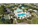 An aerial shot showcasing the community pool, amenities, and lush green spaces with convenient parking at 5325 Sandy Shell Dr, Apollo Beach, FL 33572