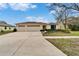 Charming single-story home featuring a spacious driveway and a well-maintained front yard with mature landscaping at 5325 Sandy Shell Dr, Apollo Beach, FL 33572
