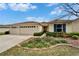 Inviting single-Gathering home with an attached two car garage, beautiful landscaping, and manicured lawn at 5325 Sandy Shell Dr, Apollo Beach, FL 33572