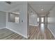 Bright hallway featuring wood-look flooring, fresh paint and natural light, creating a welcoming transition at 5325 Sandy Shell Dr, Apollo Beach, FL 33572