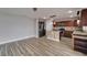 A modern kitchen with stainless steel appliances, wood cabinets, and tile backsplash at 5325 Sandy Shell Dr, Apollo Beach, FL 33572