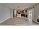 Open kitchen with wooden cabinetry, stone countertops, and stainless steel appliances at 5325 Sandy Shell Dr, Apollo Beach, FL 33572